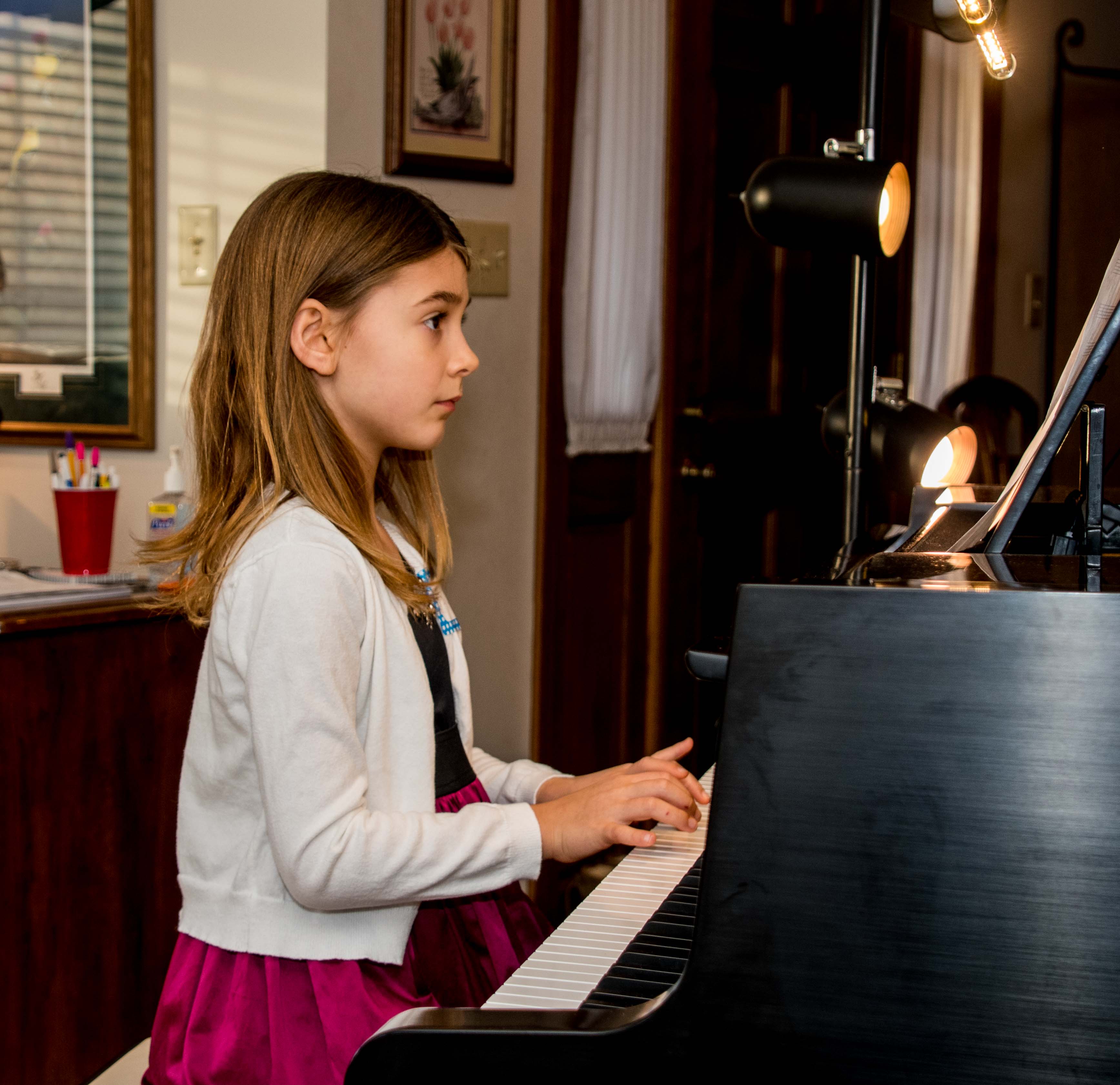 girl at grand piano